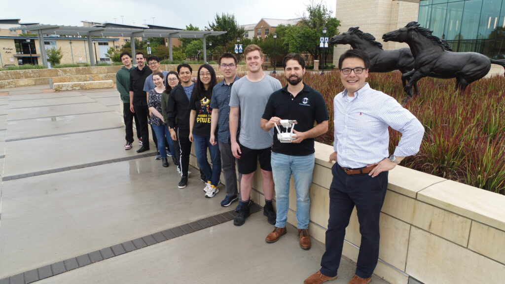 Group photo outside with drone