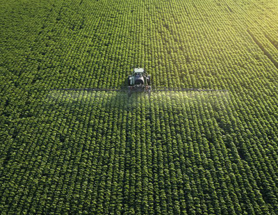 Agriculture Collaboration Study photo of crops being tended by a tractor